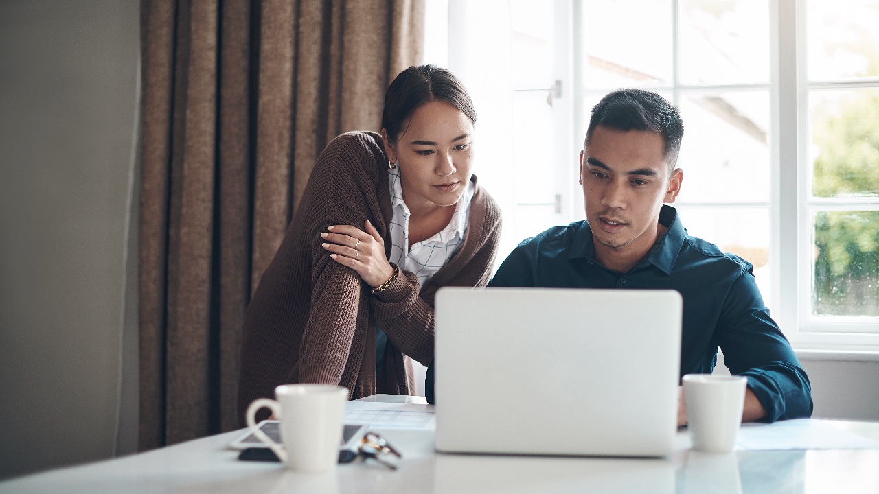 Couple, laptop and online with budget in kitchen for savings