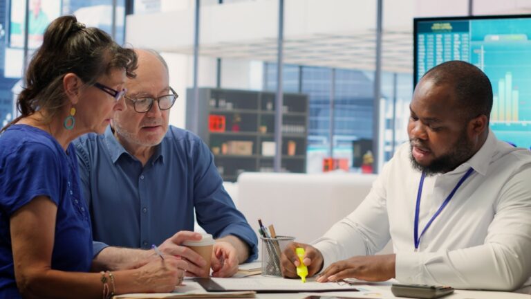 Two retirees meet with financial advisor