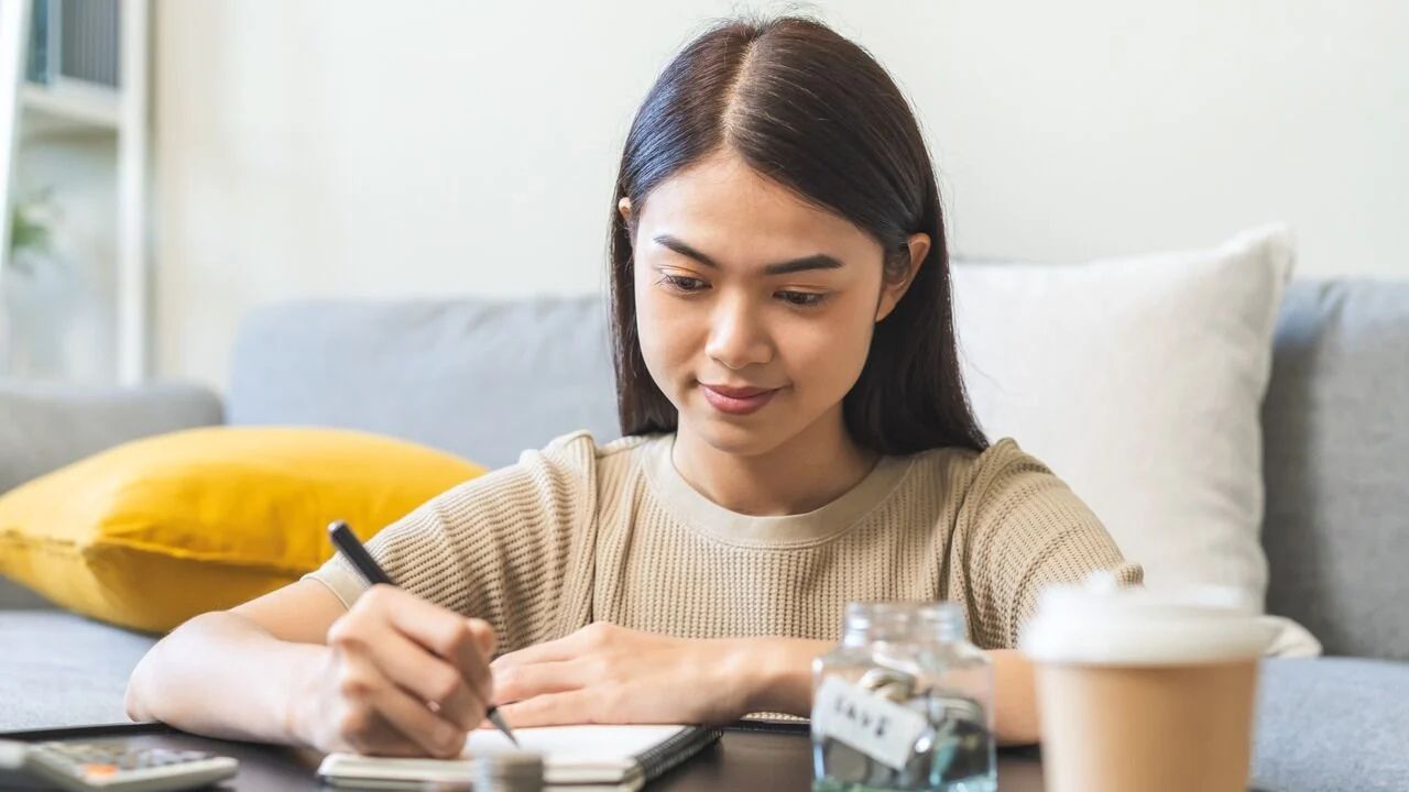 A young woman budgeting.