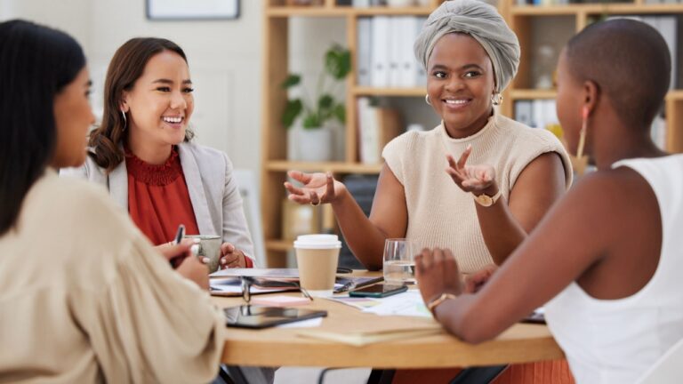 Business women, meeting and leader talking, discussion or conversation in office workplace