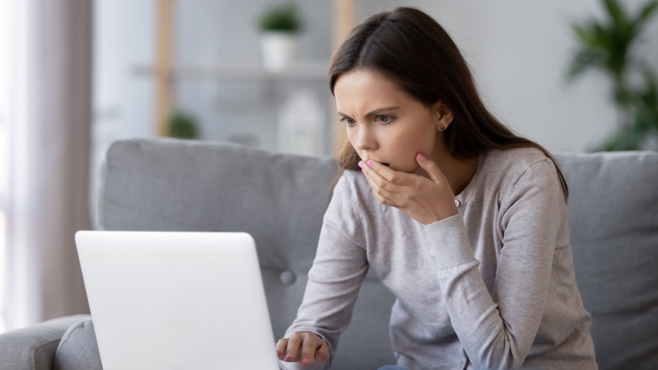 Shocked stressed young woman reading bad online news looking at broken laptop screen, confused teen girl in panic frustrated with stuck computer problem mistake virus, negative social media message